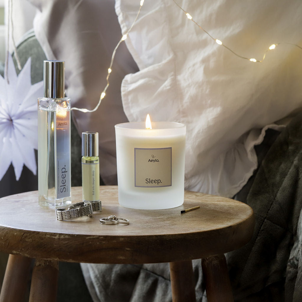 aromatherapy candles and spray for sleep ritual