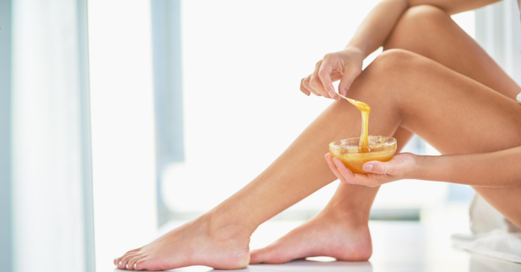 Woman waxing her legs