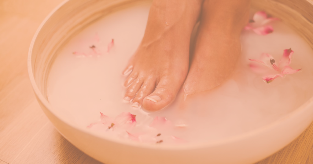 feet soaking in wooden bowl