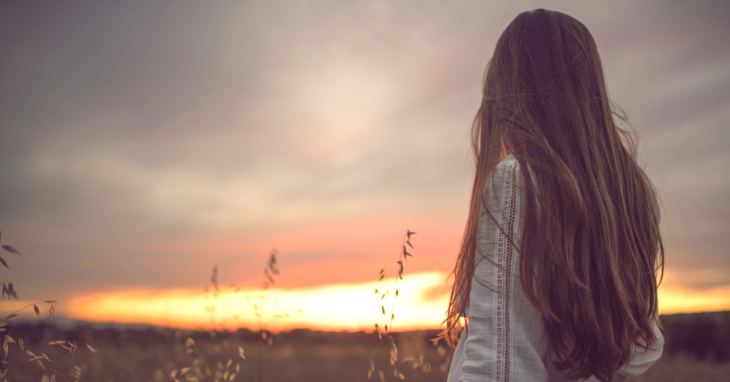 Woman watching sunset